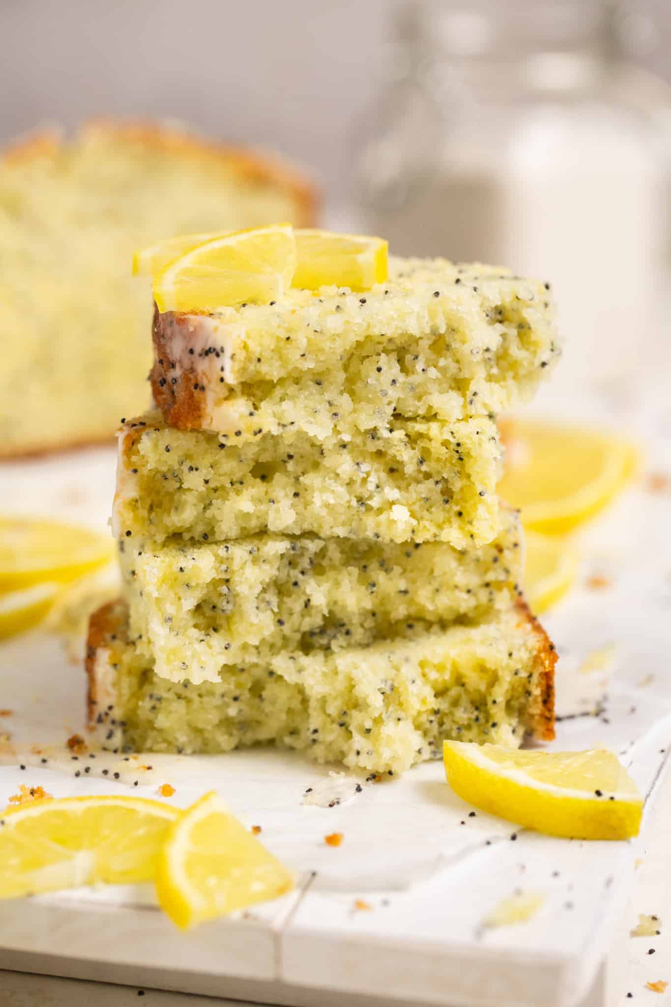 lemon poppyseed cake slices stacked on top of each other.