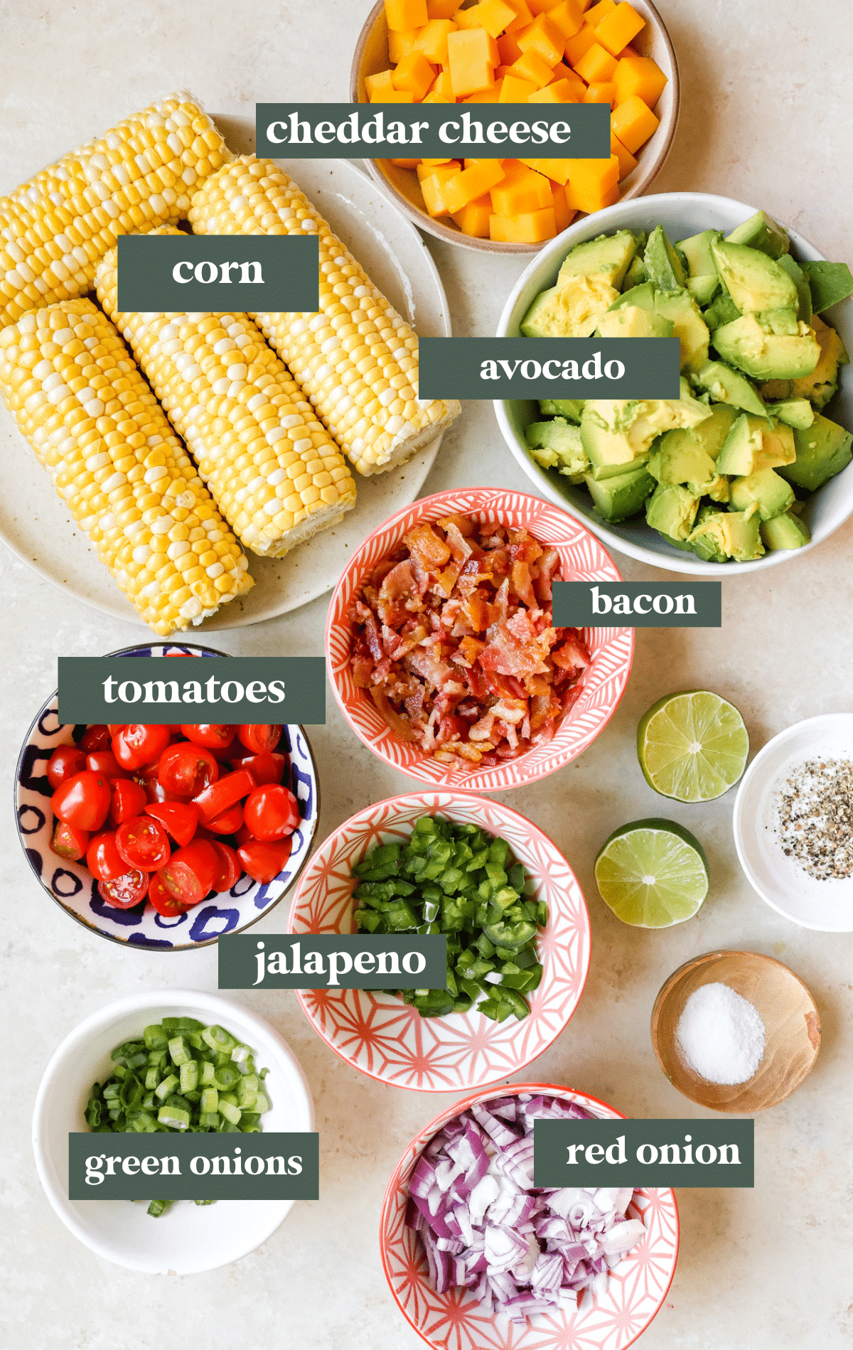 ingredients in small glass bowls needed to make a corn salad. 