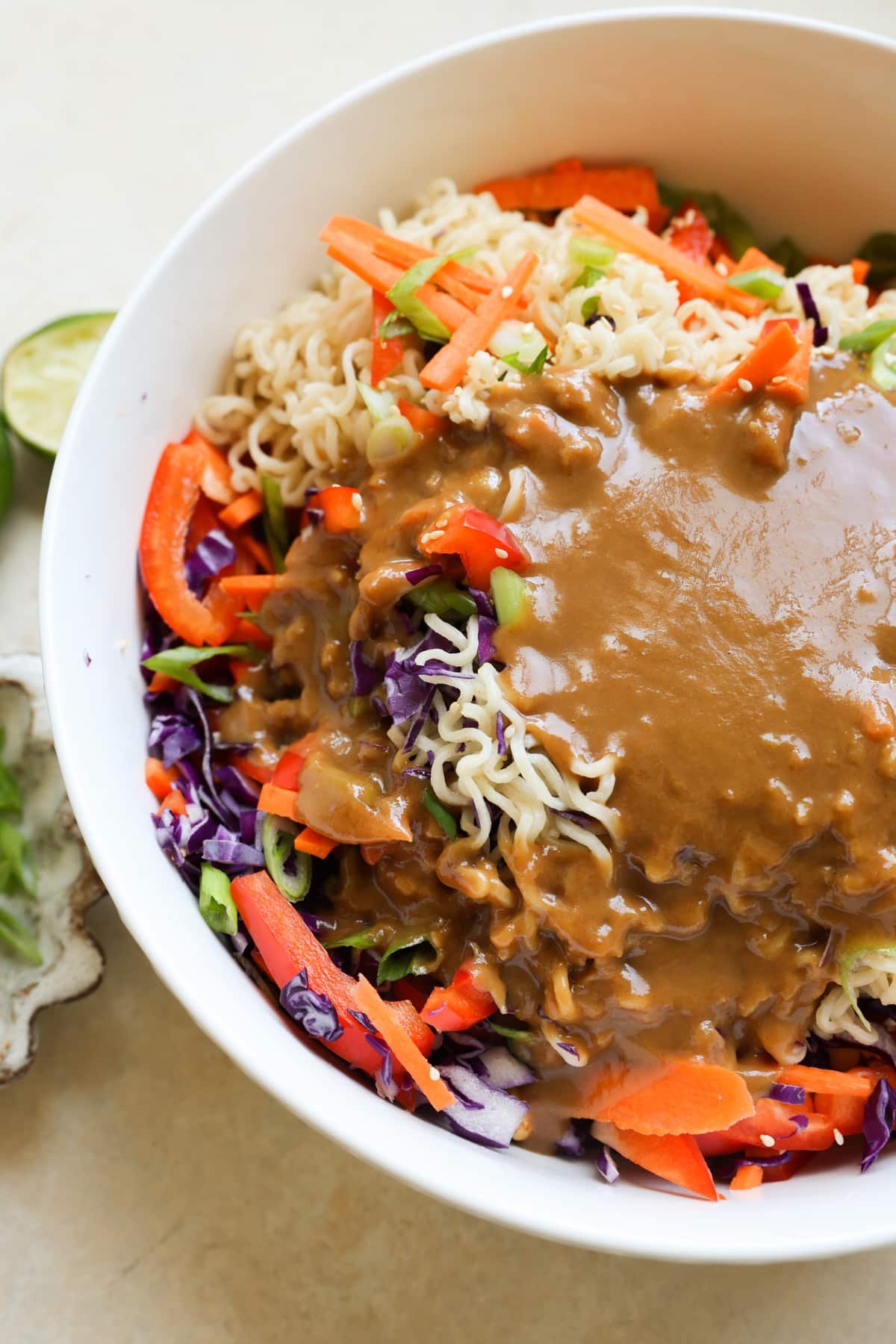 noodle salad with a peanut dressing poured on top. 
