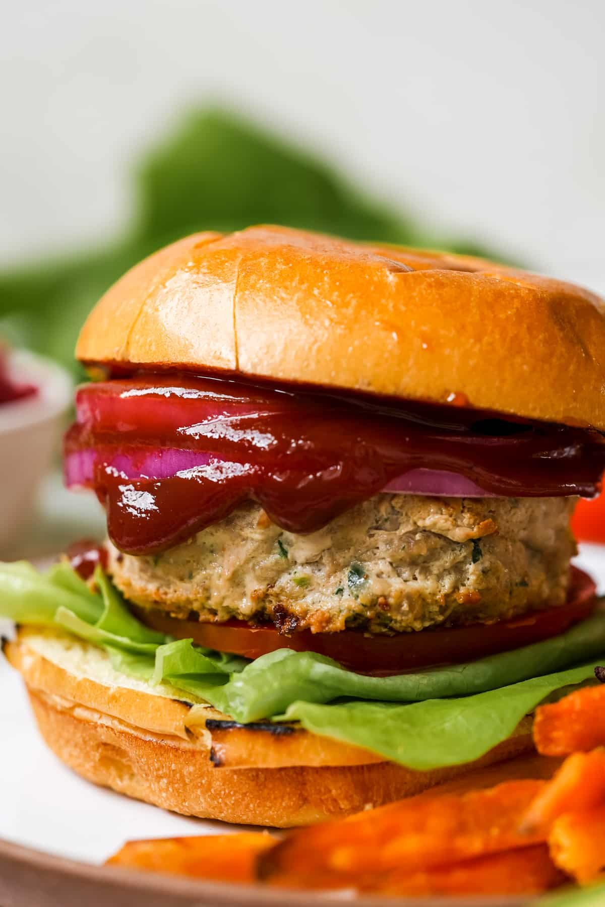 burger with lettuce and deep red pomegranate ketchup