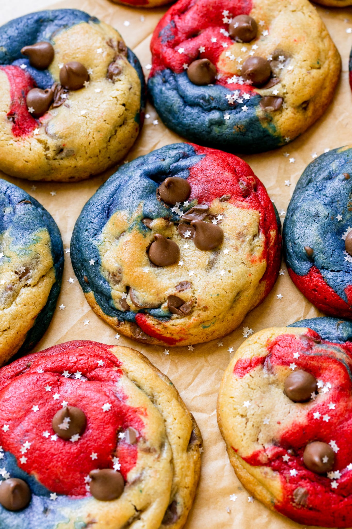 a festive cookie made with red and blue food coloring decorated with silver glitter stars. 