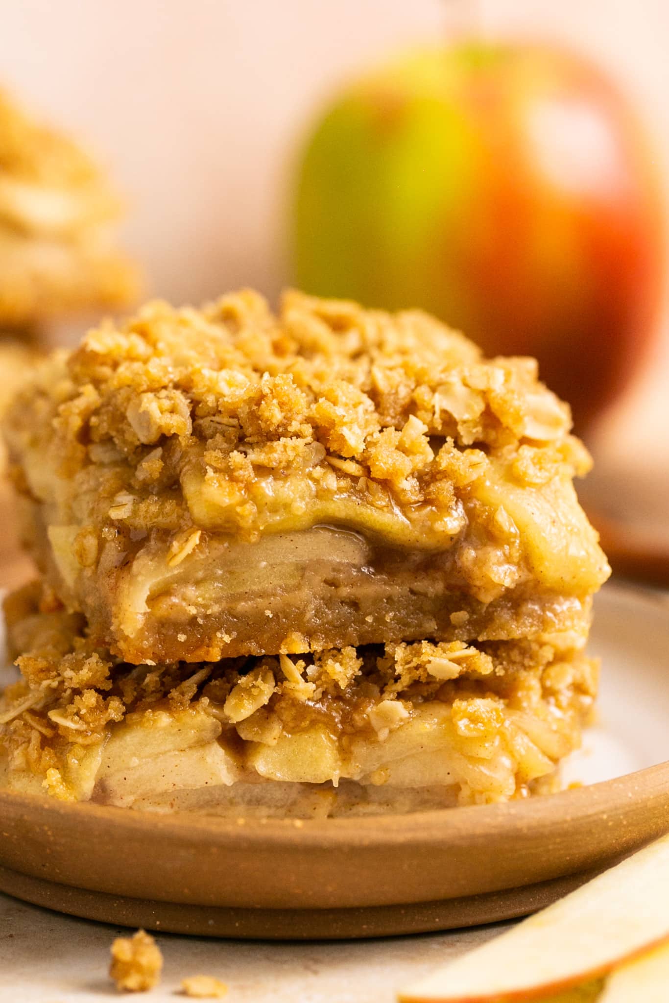 Apple pie bars in a bowl stacked on top of each other. 