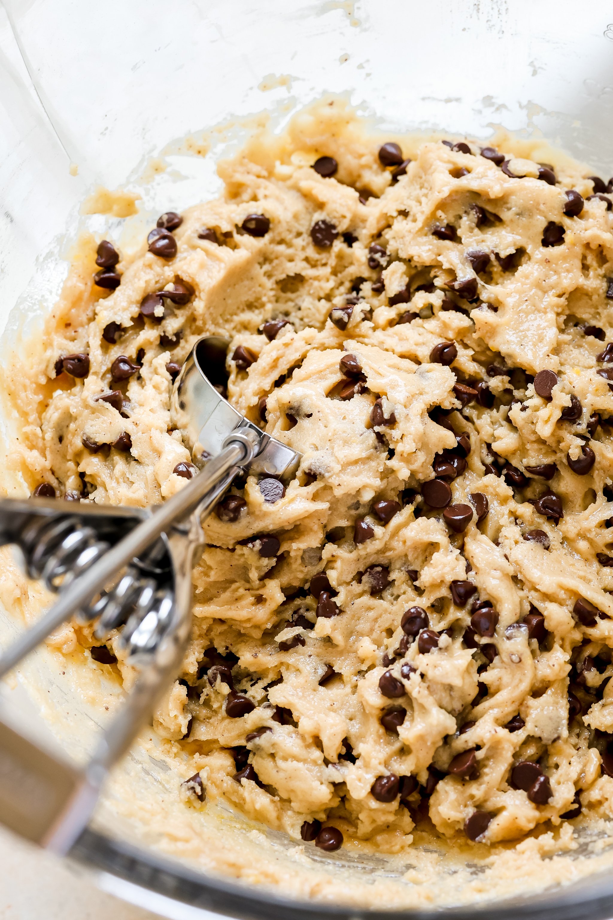 an up close image of chocolate chip cookie dough made with mini chocolate chips. 