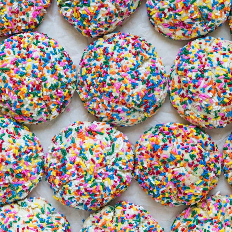 Tray full of giant, colorful, funfetti cookies.