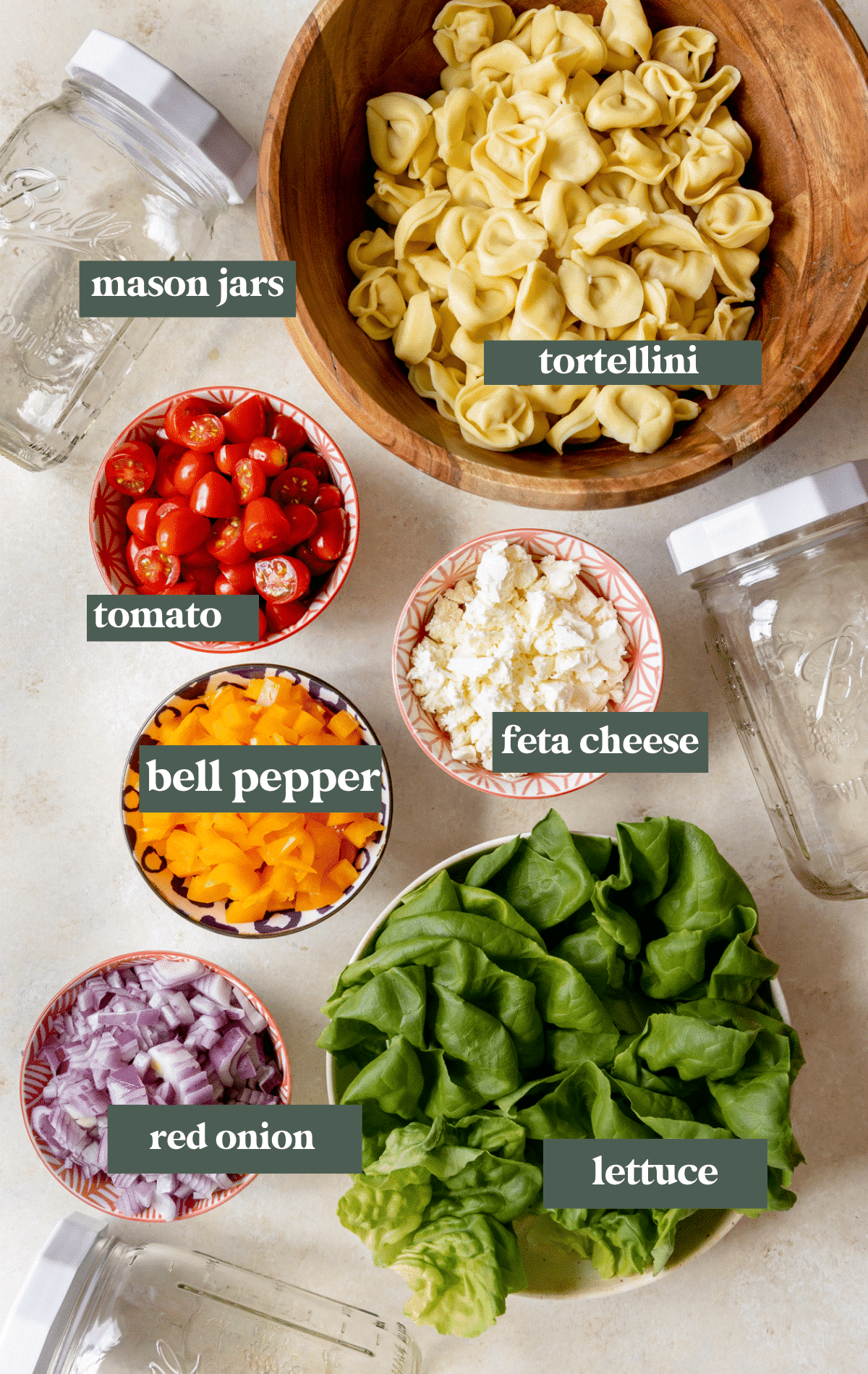 ingredients to make salad divided up into small glass bowls. 