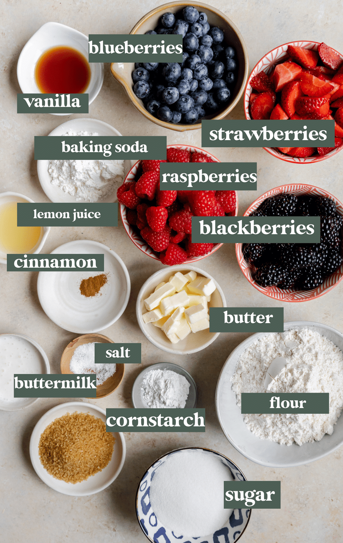 ingredients to make a berry cobbler in small glass bowls. 