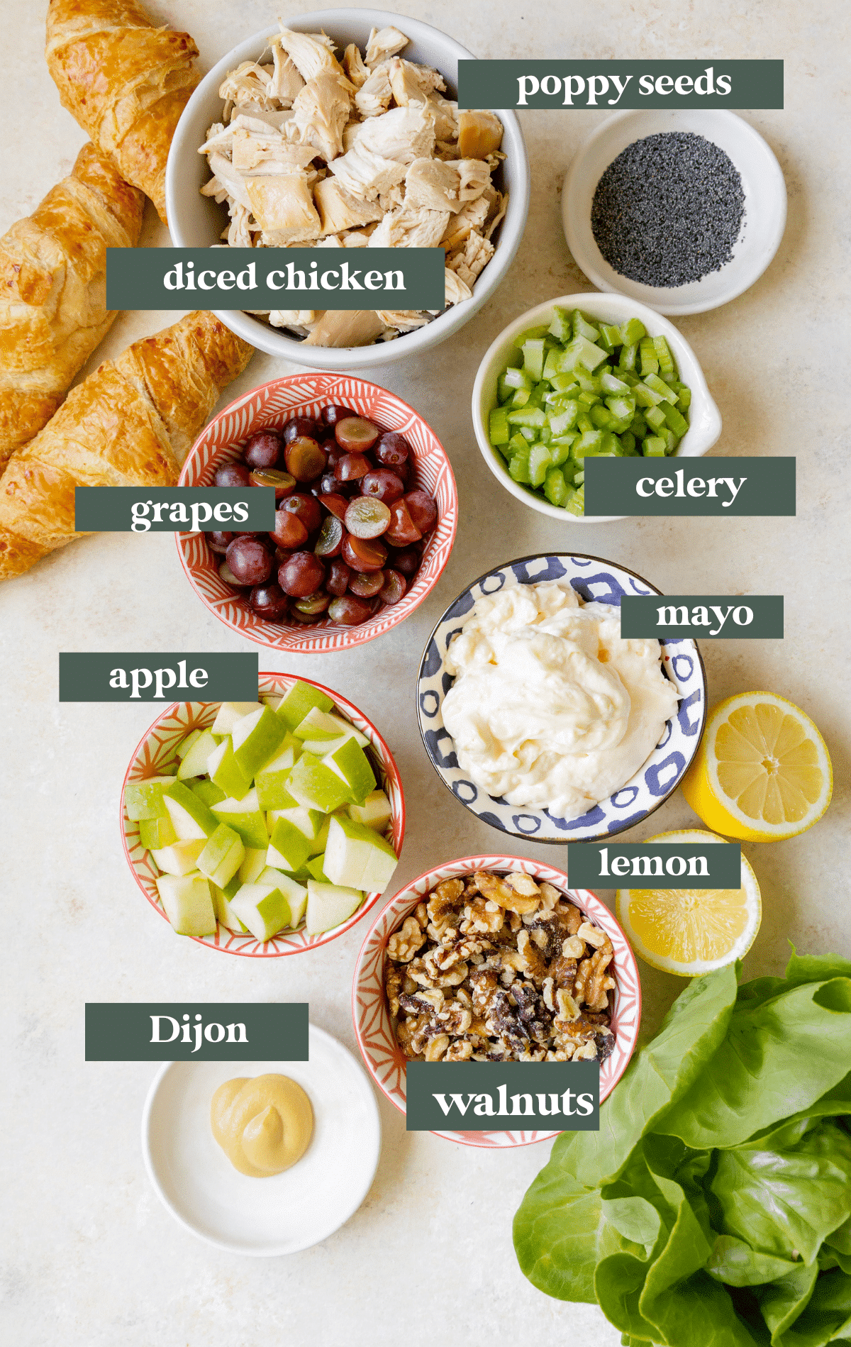 ingredients needed to make chicken salad in small glass bowls. 