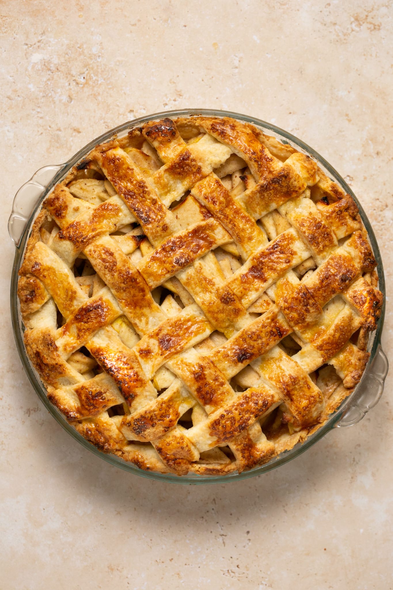 a baked apple pie with lattice crust. 