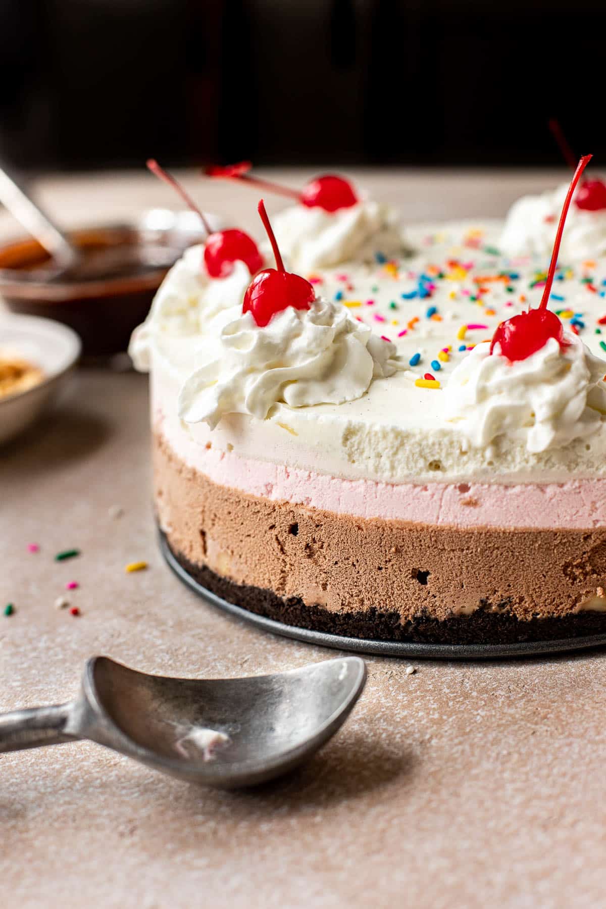 ice cream banana split topped with whipped cream and cherries. 