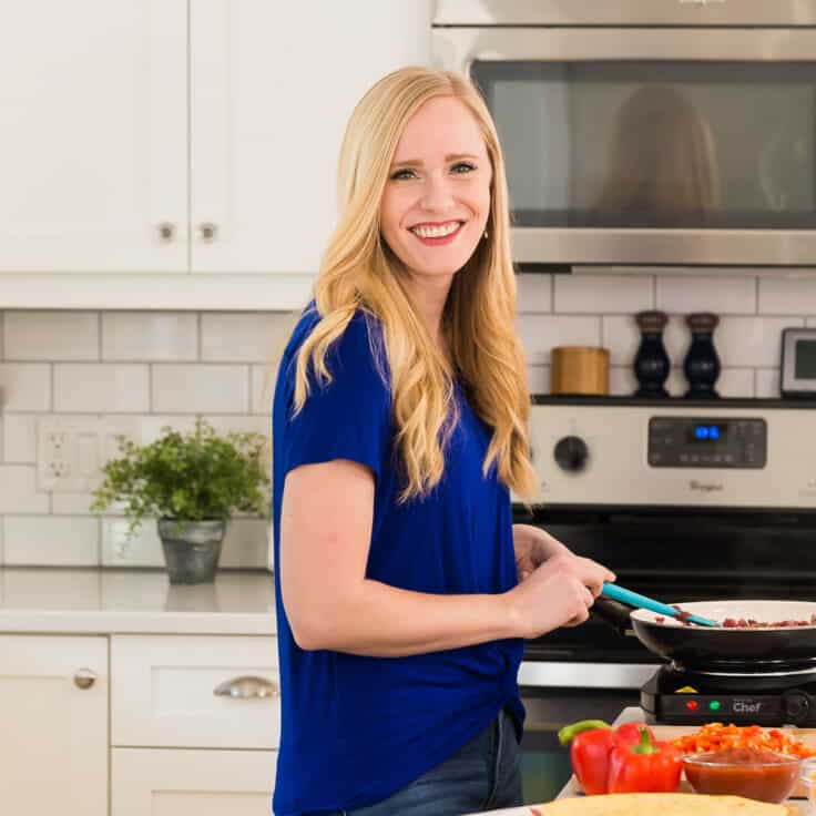 Portrait of Ashley Fehr in a kitchen.