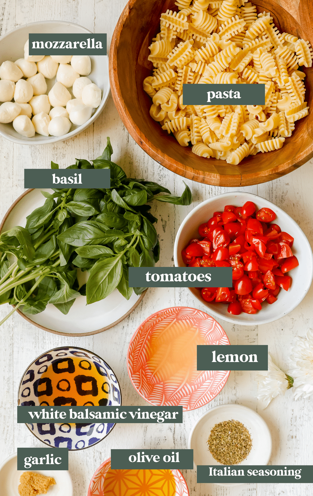 ingredients in bowls to make caprese salad. 