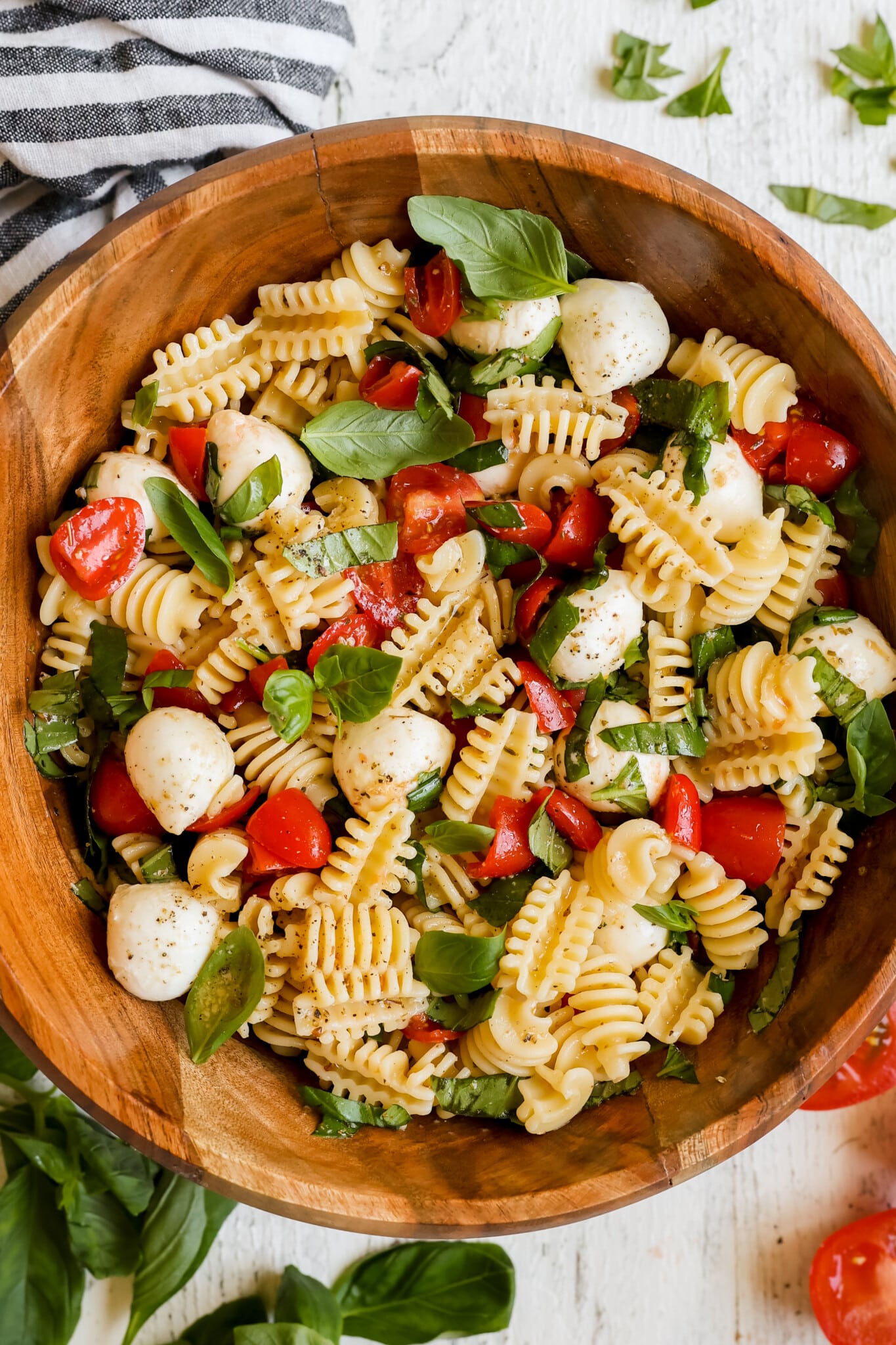 pasta salad in a wooden salad bowl. 