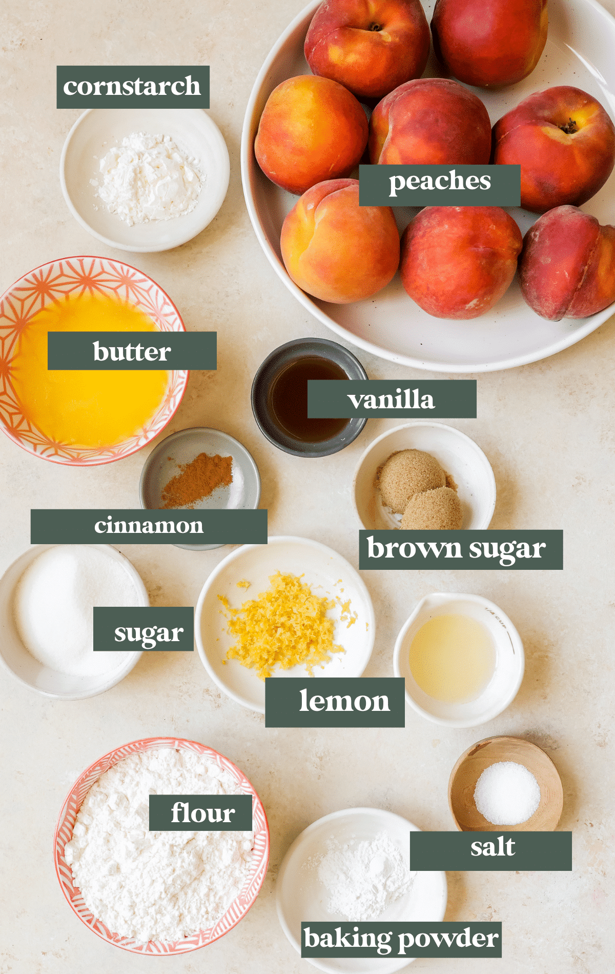 ingredients in small dishes needed to make peach cobblers. 