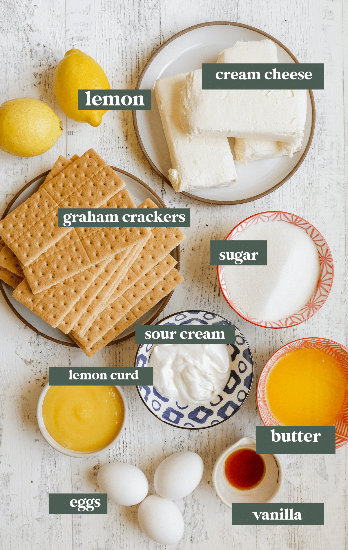 ingredients needed to make lemon cheesecake in small glass bowls and plates. 