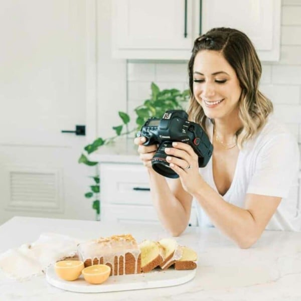 tawnie graham with a camera in her kitchen