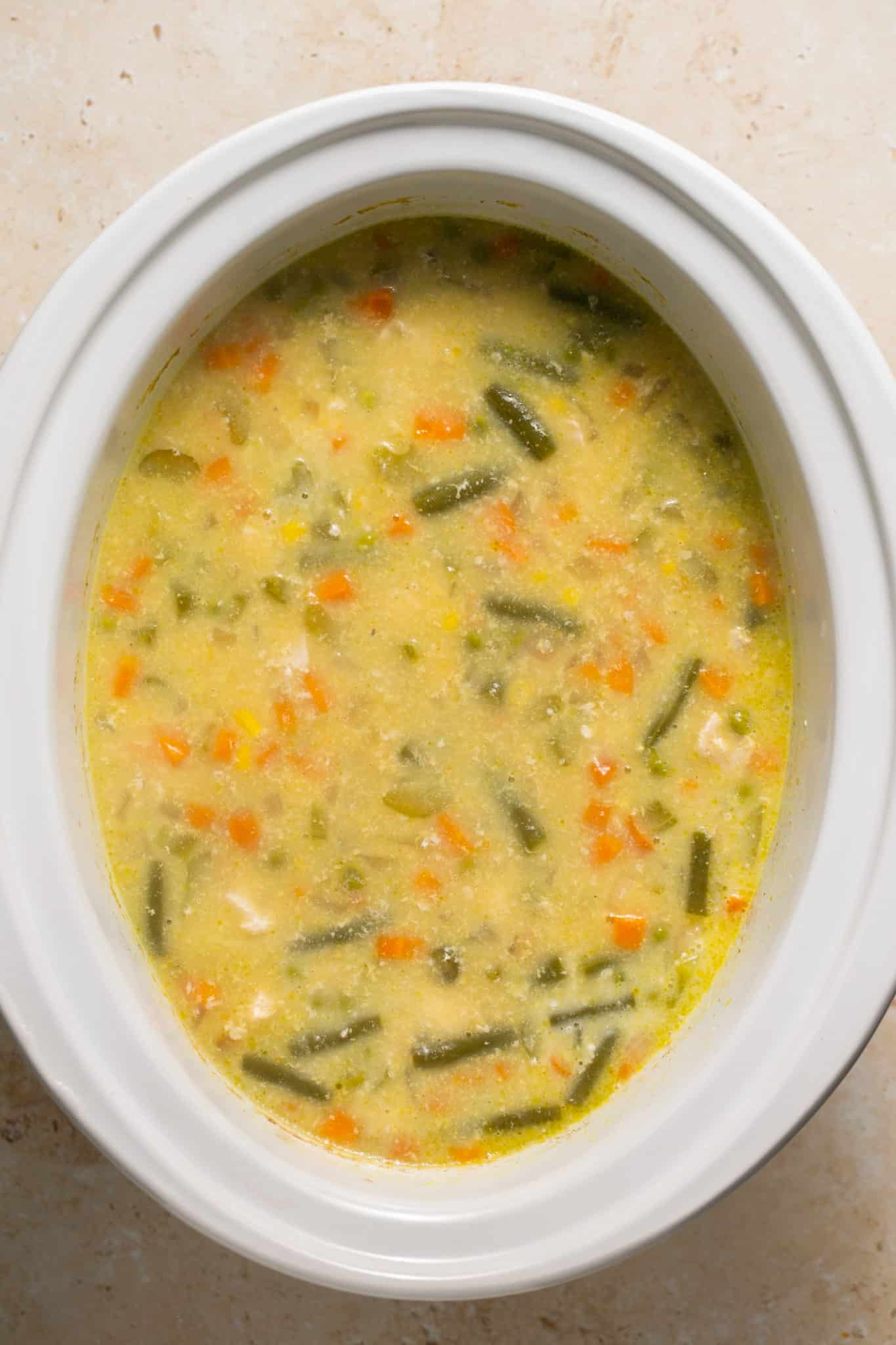 soup in a white crock pot.