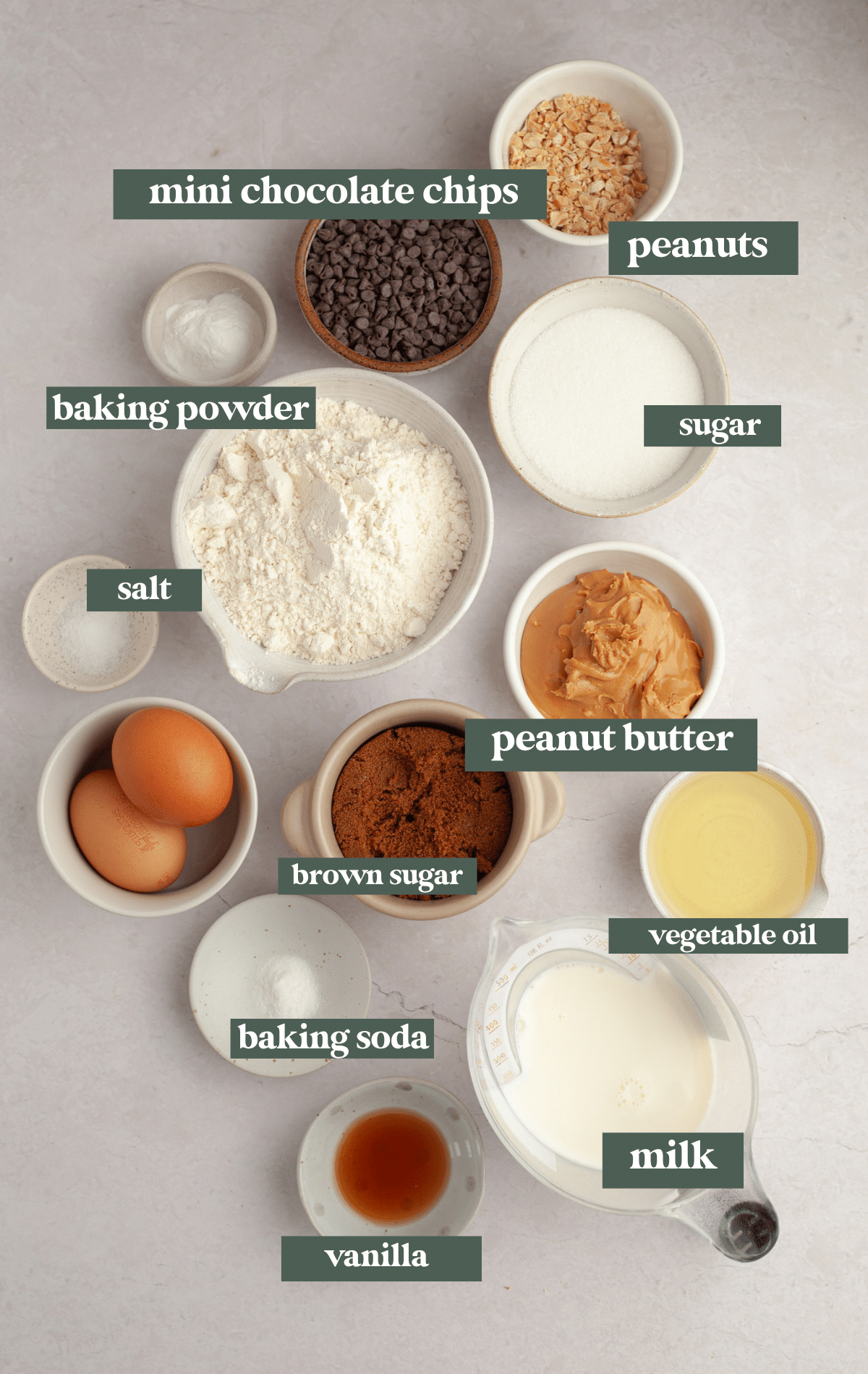 ingredients in small bowls needed to make muffins. 