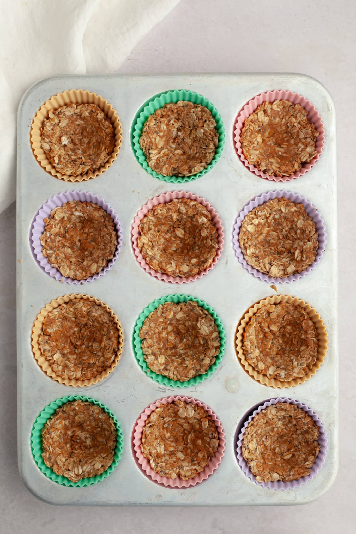 oatmeal in a muffin tin in silicone muffin liners. 