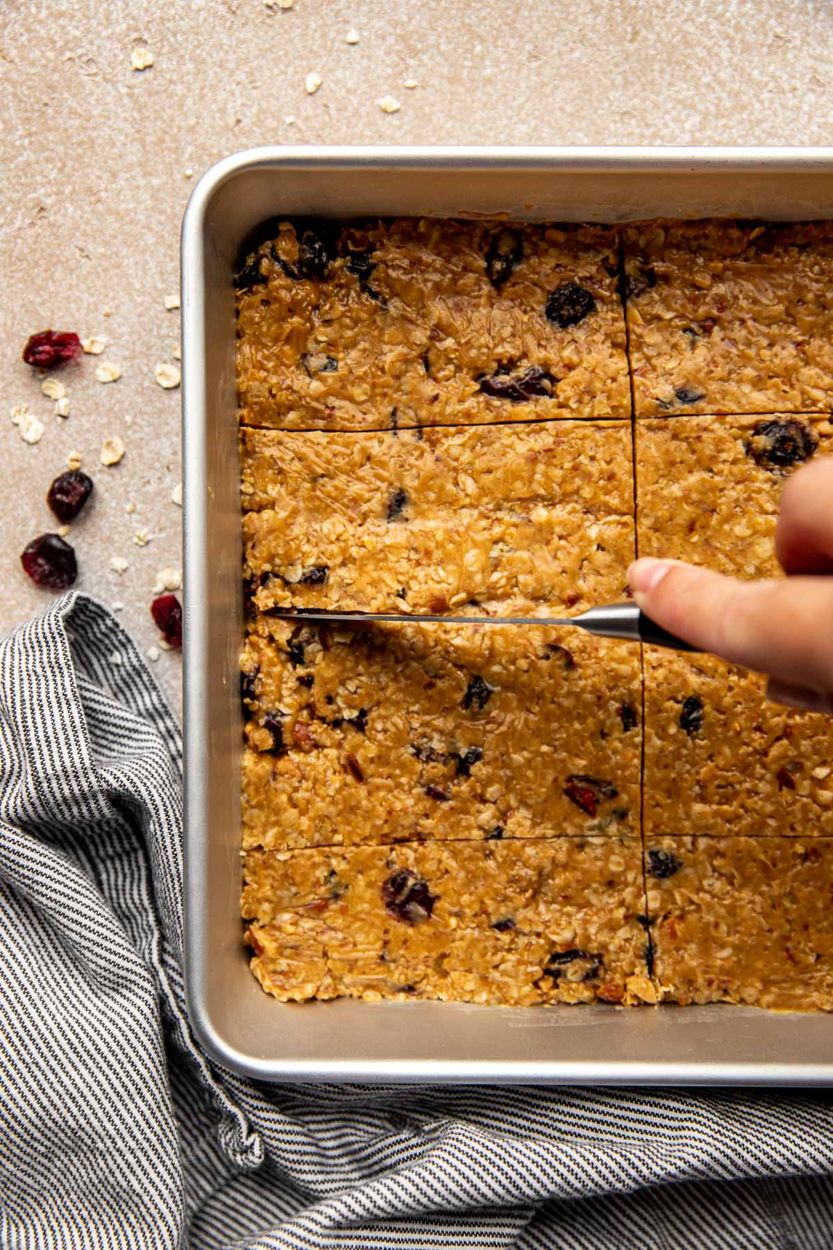 a knife cutting into energy bars. 