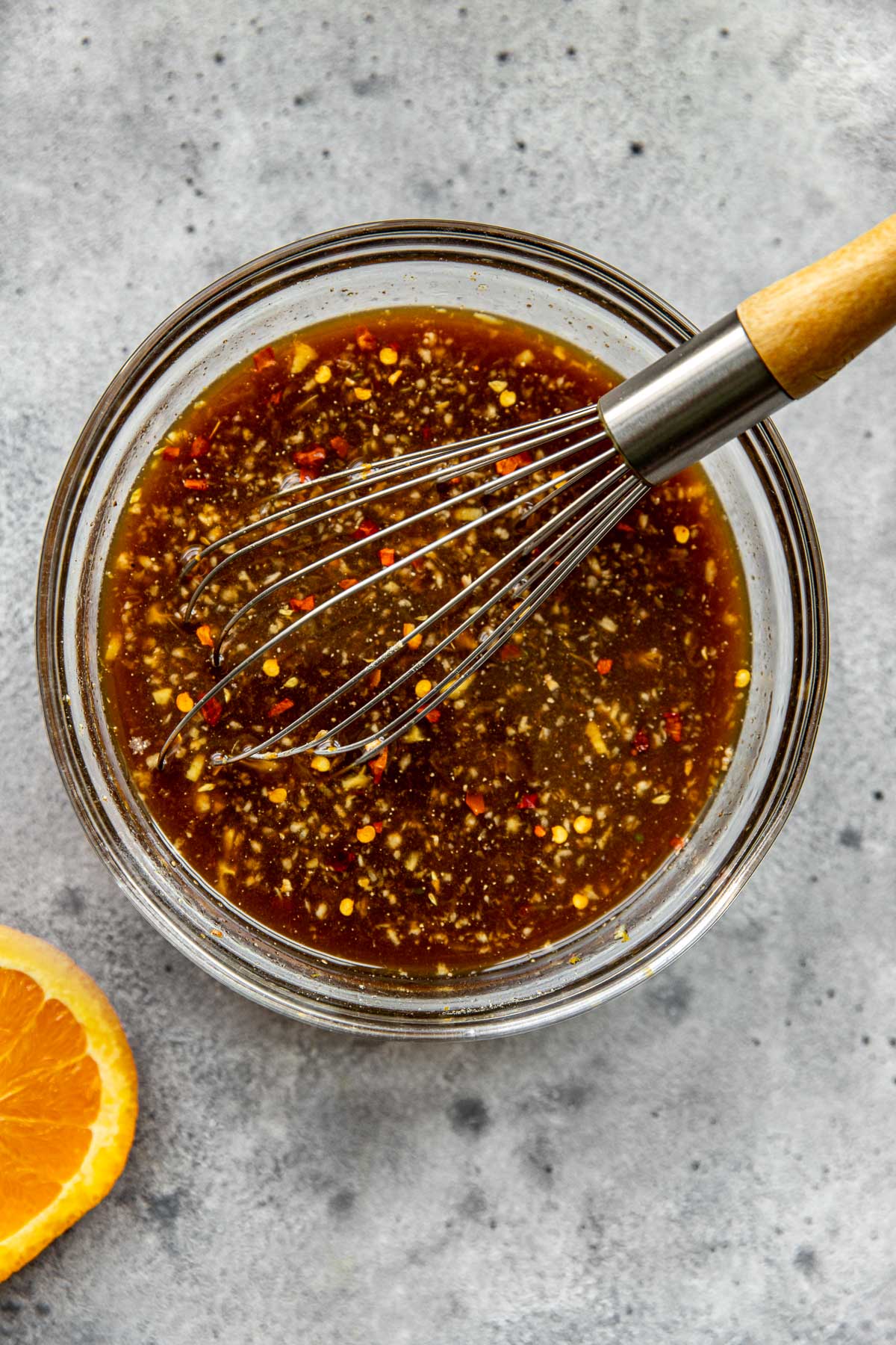 sauce ingredients whisked together in a glass bowl. 