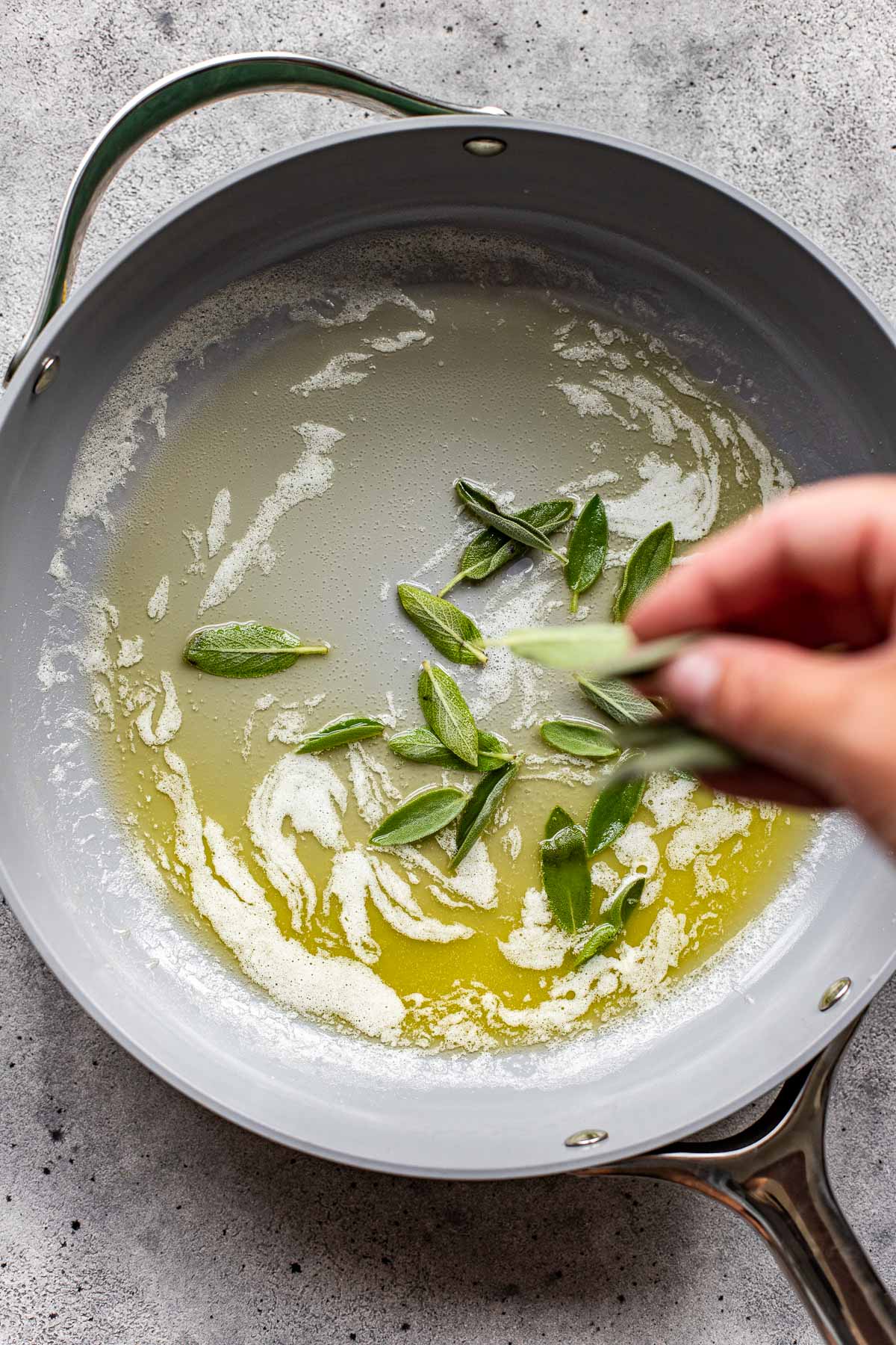 fresh sage leaves in melted butter in a saute pan. 