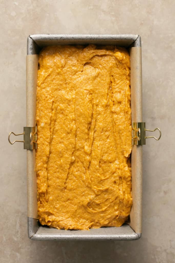 pumpkin bread made with bananas in a 9x5 inch baking pan lined with parchment paper. 