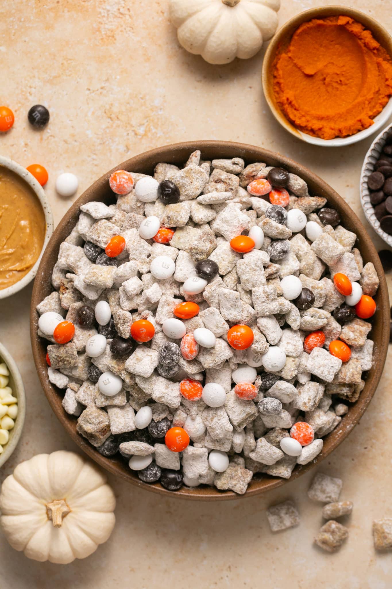 puppy chow with m&ms in a brown bowl. 