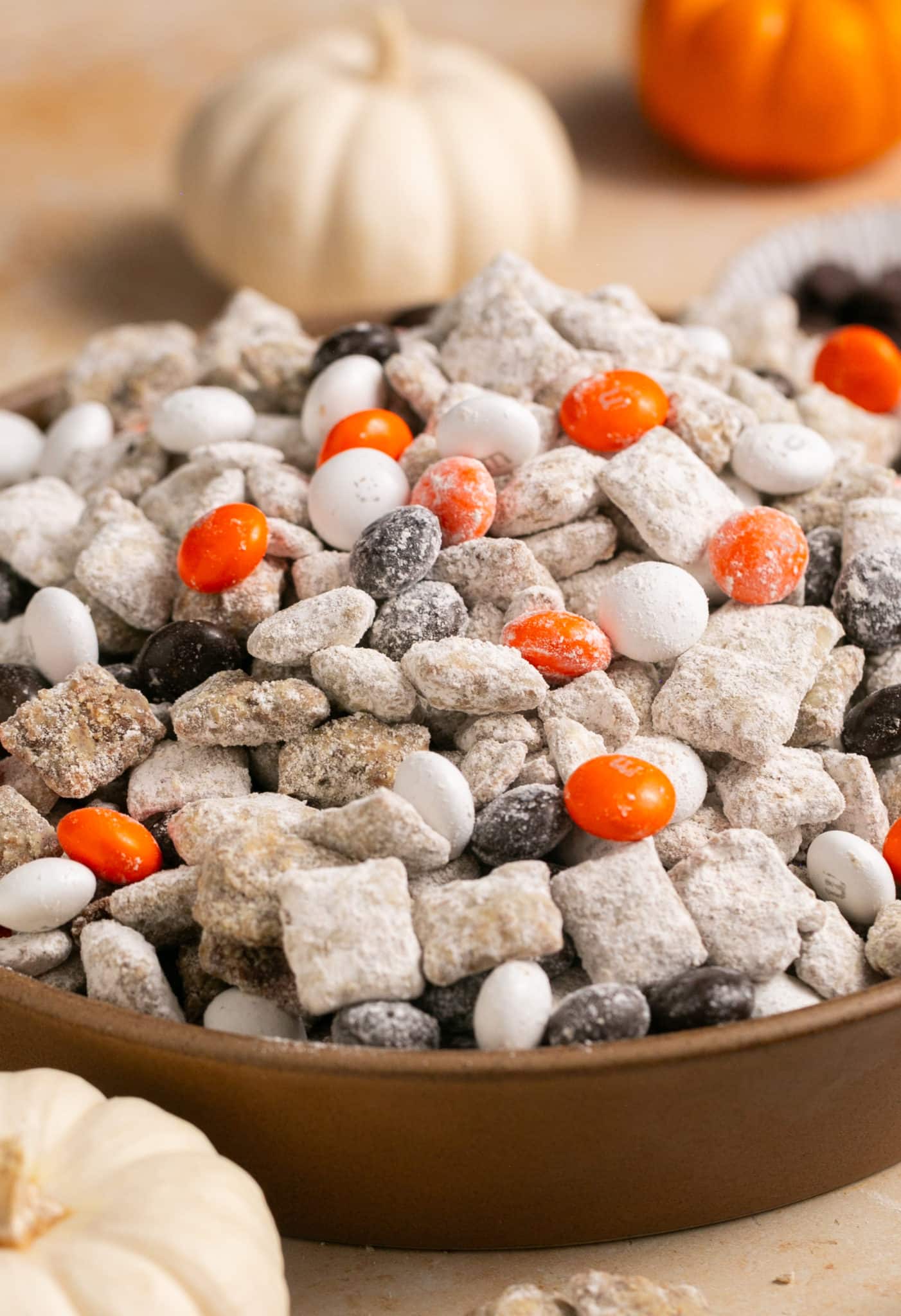 puppy chow with m&ms in a brown bowl. 