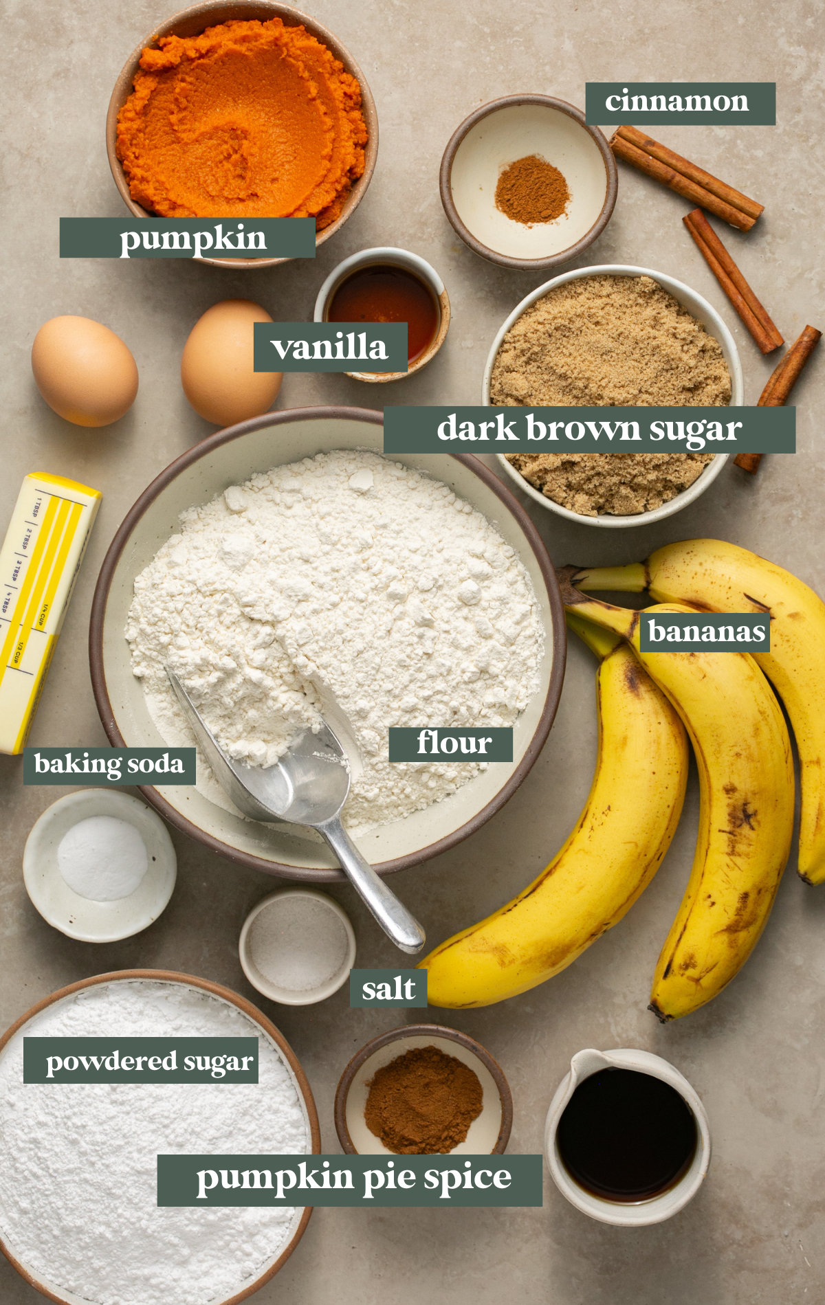 ingredients to make banana bread with pumpkin in small glass bowls. 