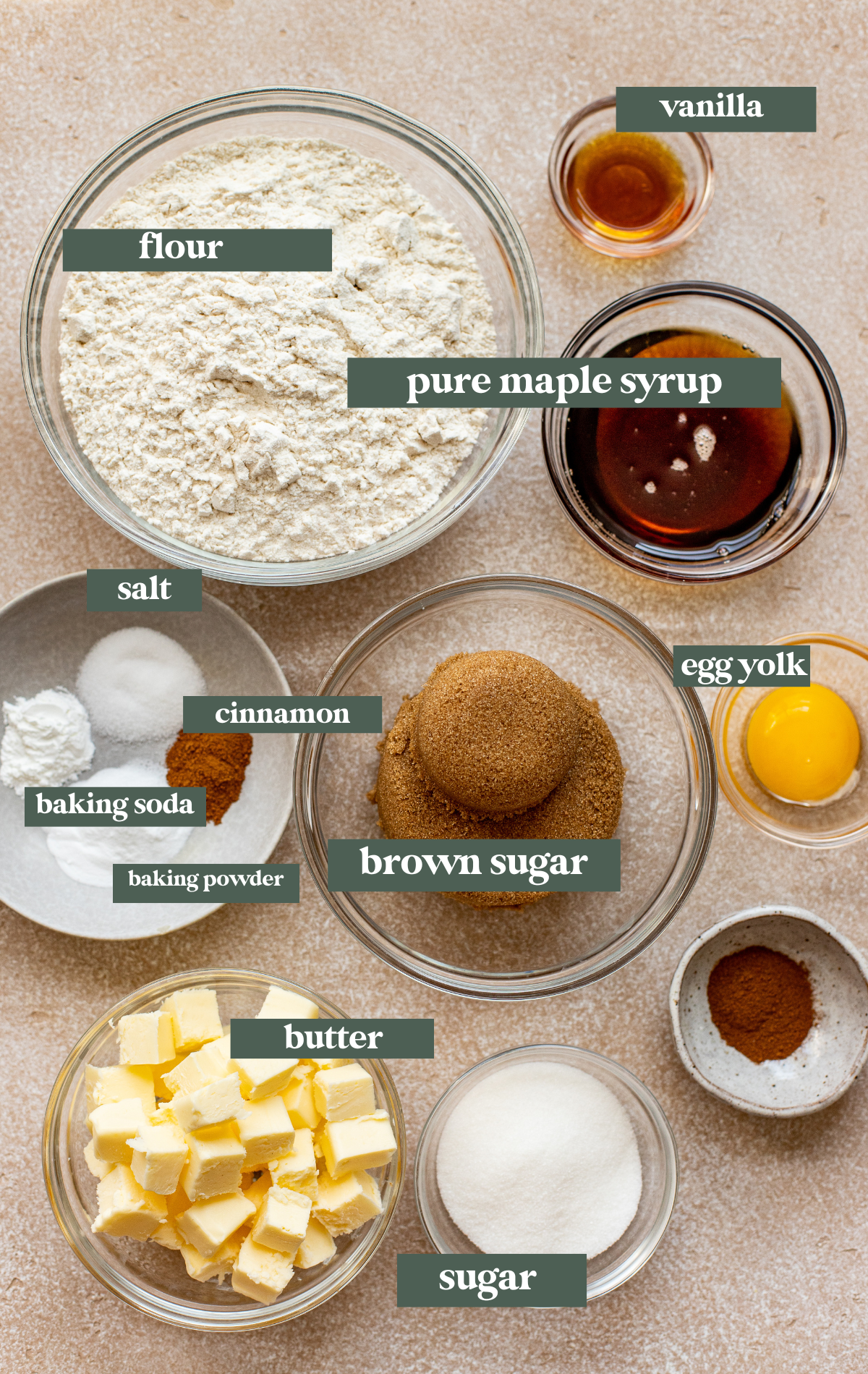 ingredients in glass bowls needed to make cookies made with pure maple syrup. 