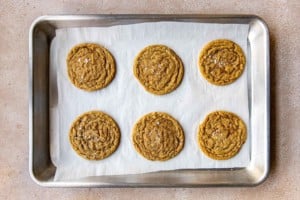 six cookies on a baking sheet