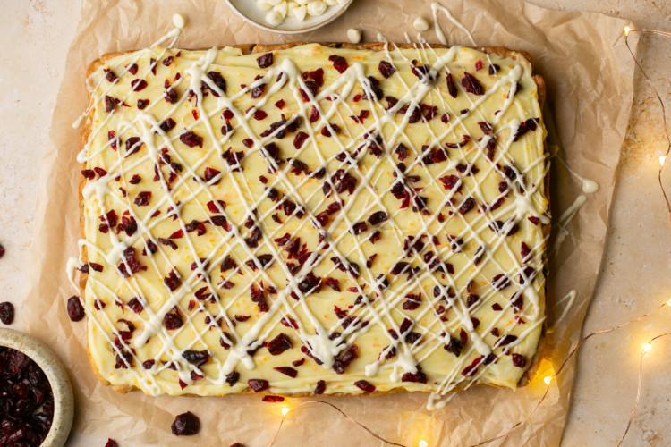 sheet of cranberry bliss bars with twinkle lights