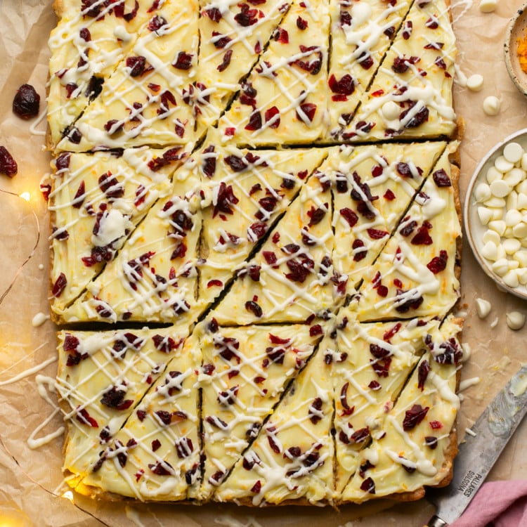 sheet of cranberry bliss bars with triangleur cuts made