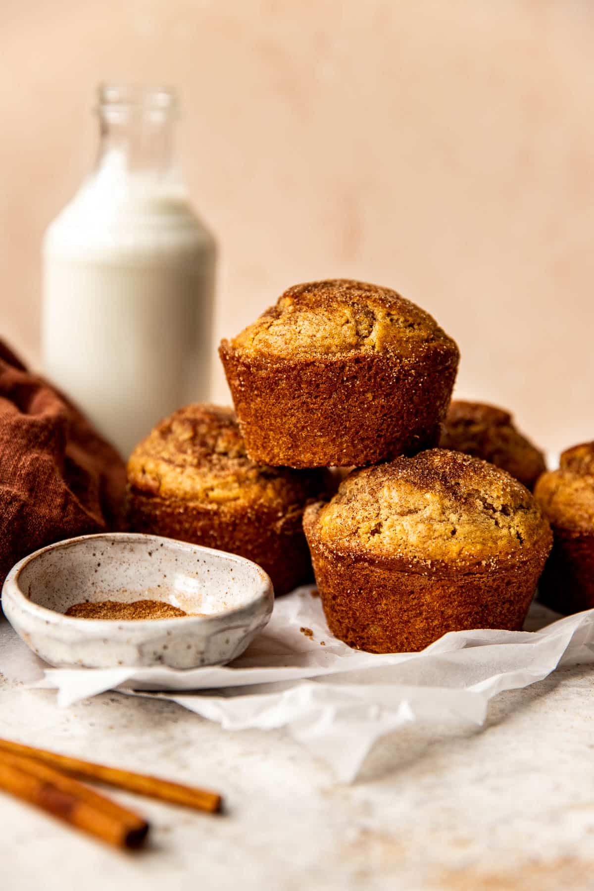 snickerdoodle muffins on parchment paper. 