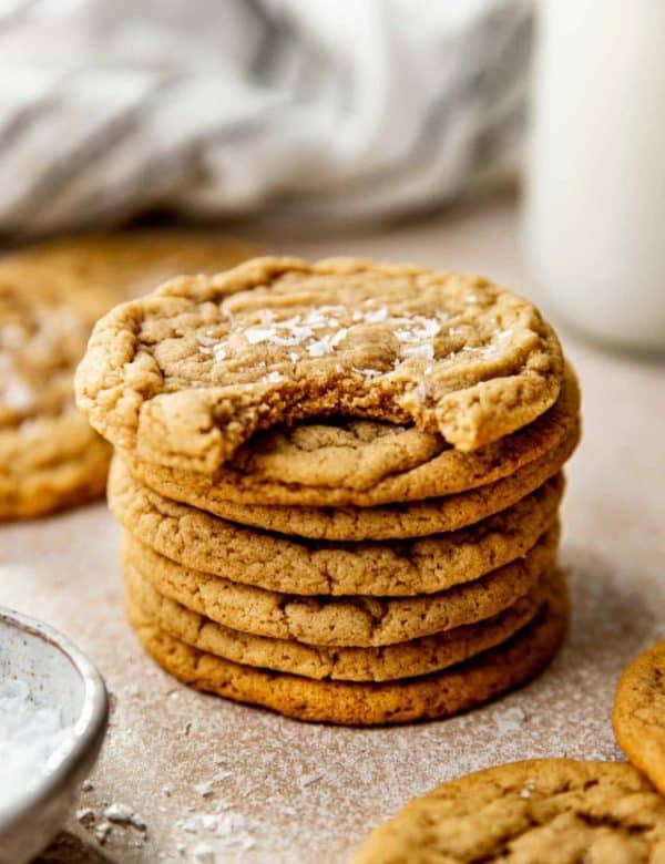 stack of chocolate chipless cookies with a bite out of the top cookie