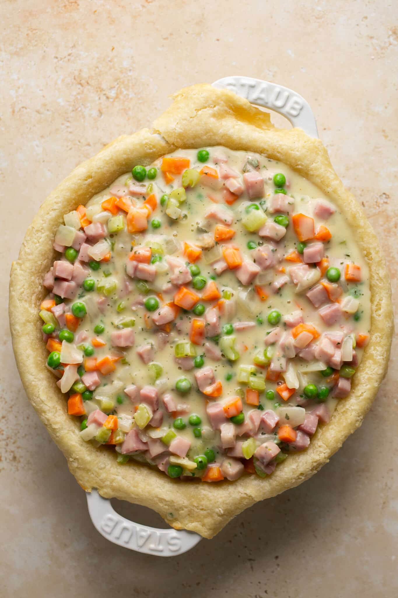 pot pie filling in a pie plate with pie crust. 