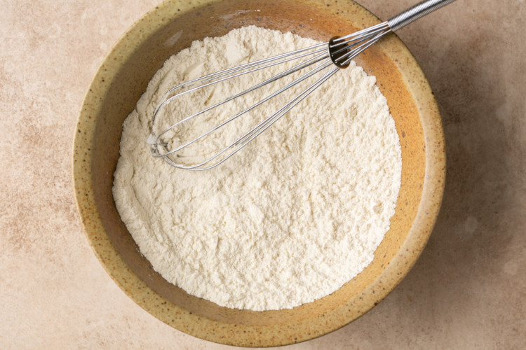 flour with whisk in a bowl