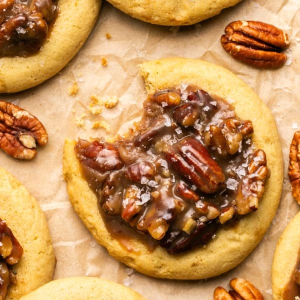 overhead shot of a pecan pie cookie with a bite taken out