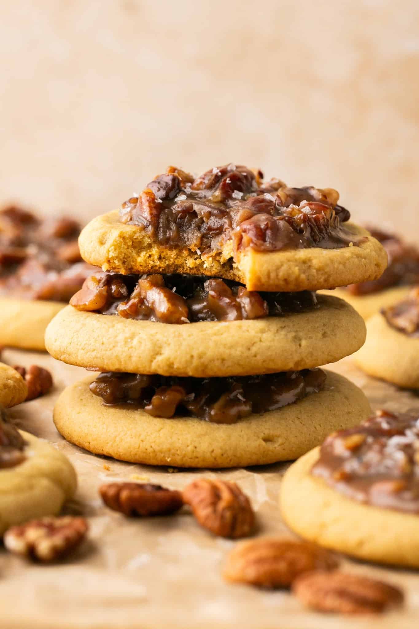 a stack of pecan pie cookies garnished with flaky sea salt. 