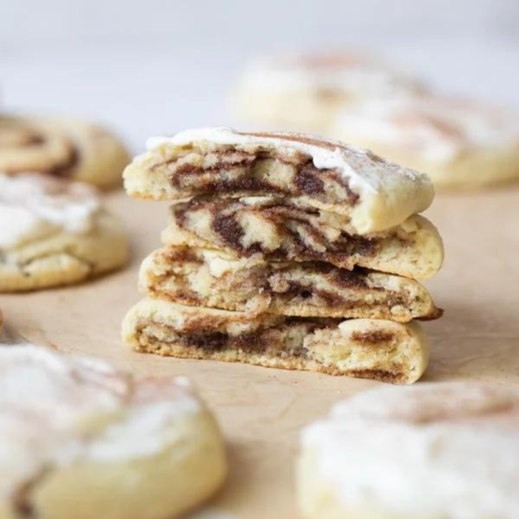 cinnamon roll cookies cut in half and stacked