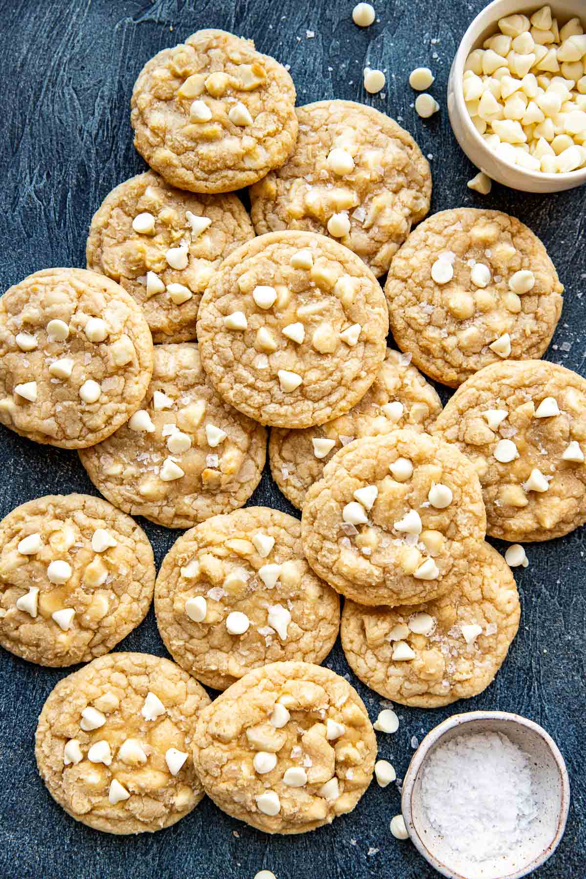 cookies with macadamia nuts and white chocolate chips laying on top of one another