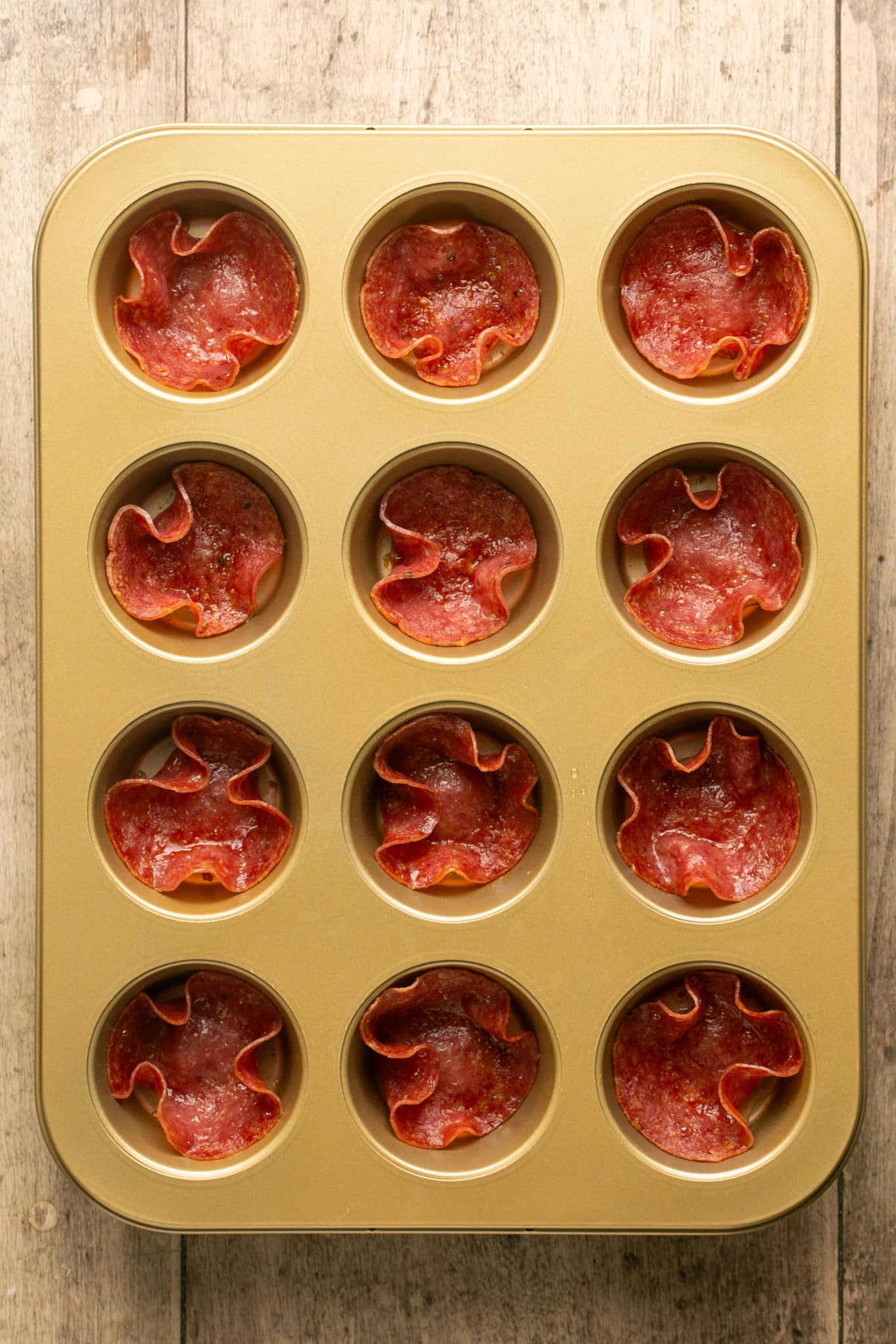 salami cups in a muffin tin. 