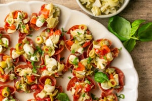 salami cups stuffed with artichokes, olives, and cheese