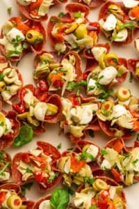 salami cups stuffed with artichokes cheese and red peppers