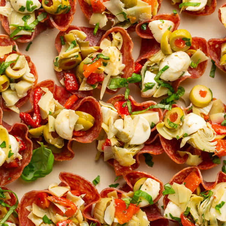 salami cups stuffed with artichokes cheese and red peppers