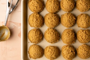 baking sheet with large balls of gingerbread snickerdoodle dough