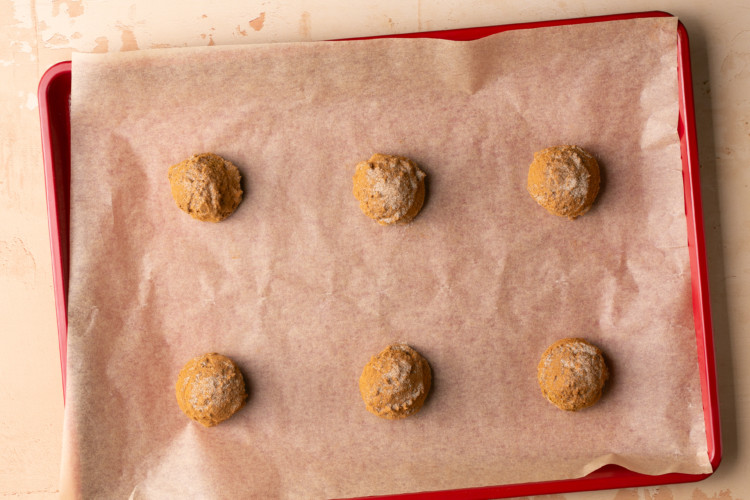 baking sheet with snickerdoodle cookie dough balls