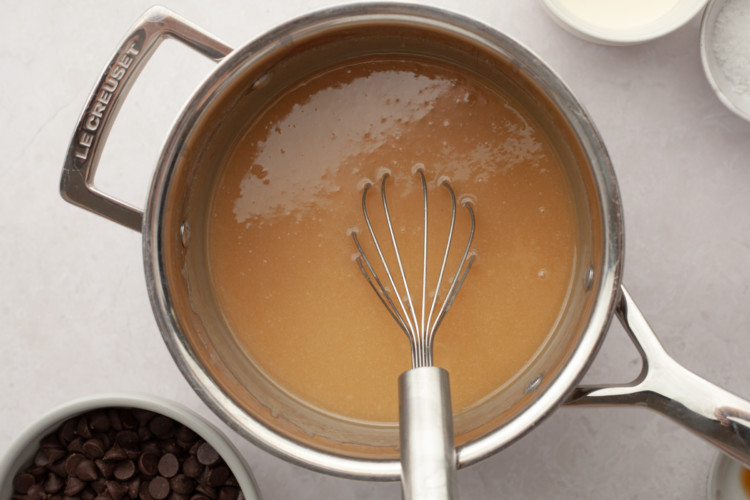 pot with whisk stirring caramel