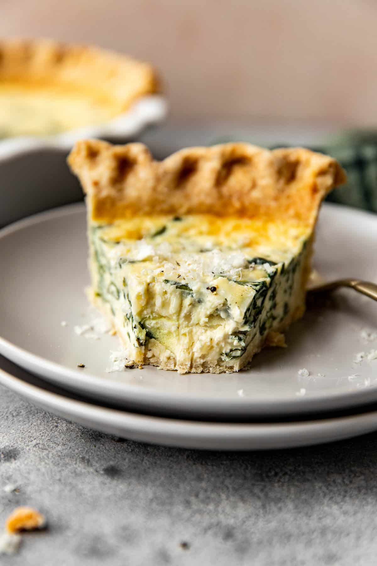 quiche on a grey plate.