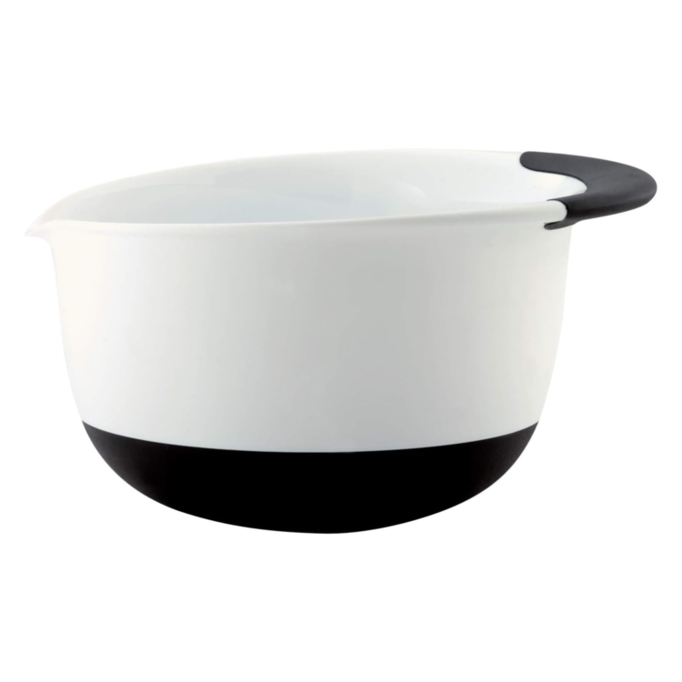 white mixing bowl with black handle and black bottom